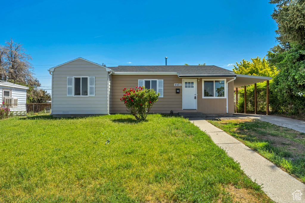 View of front of property featuring concrete driveway, an attached carport, and entry steps