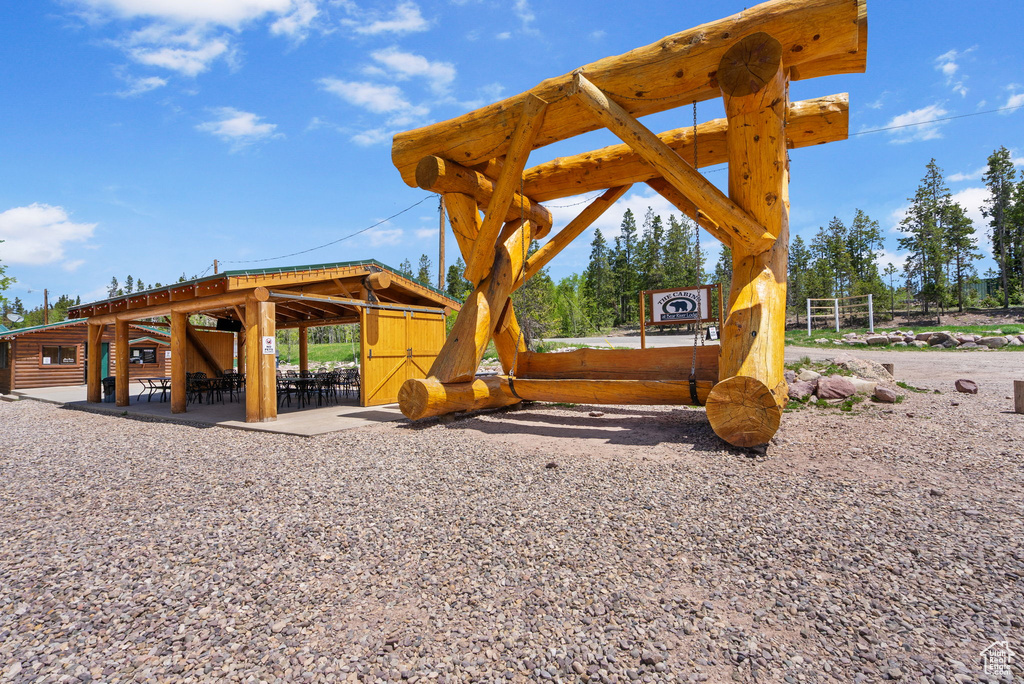 View of jungle gym with an exterior structure and an outbuilding