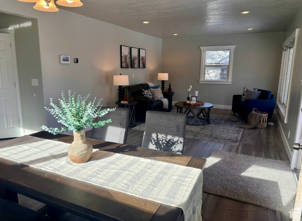 Dining room featuring wood finished floors, recessed lighting, and baseboards