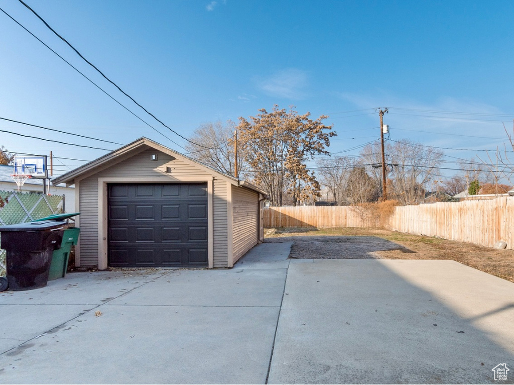 Detached garage featuring driveway