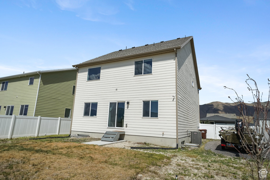 Back of house with cooling unit