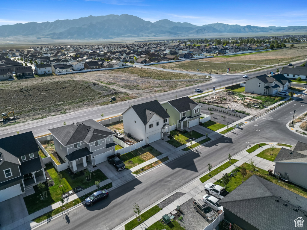 Aerial perspective of suburban area featuring a mountain backdrop