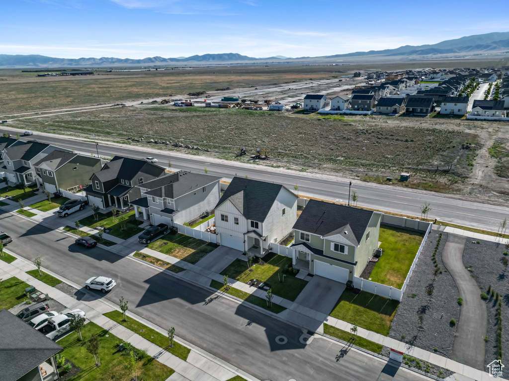 Aerial view of residential area with a mountain backdrop
