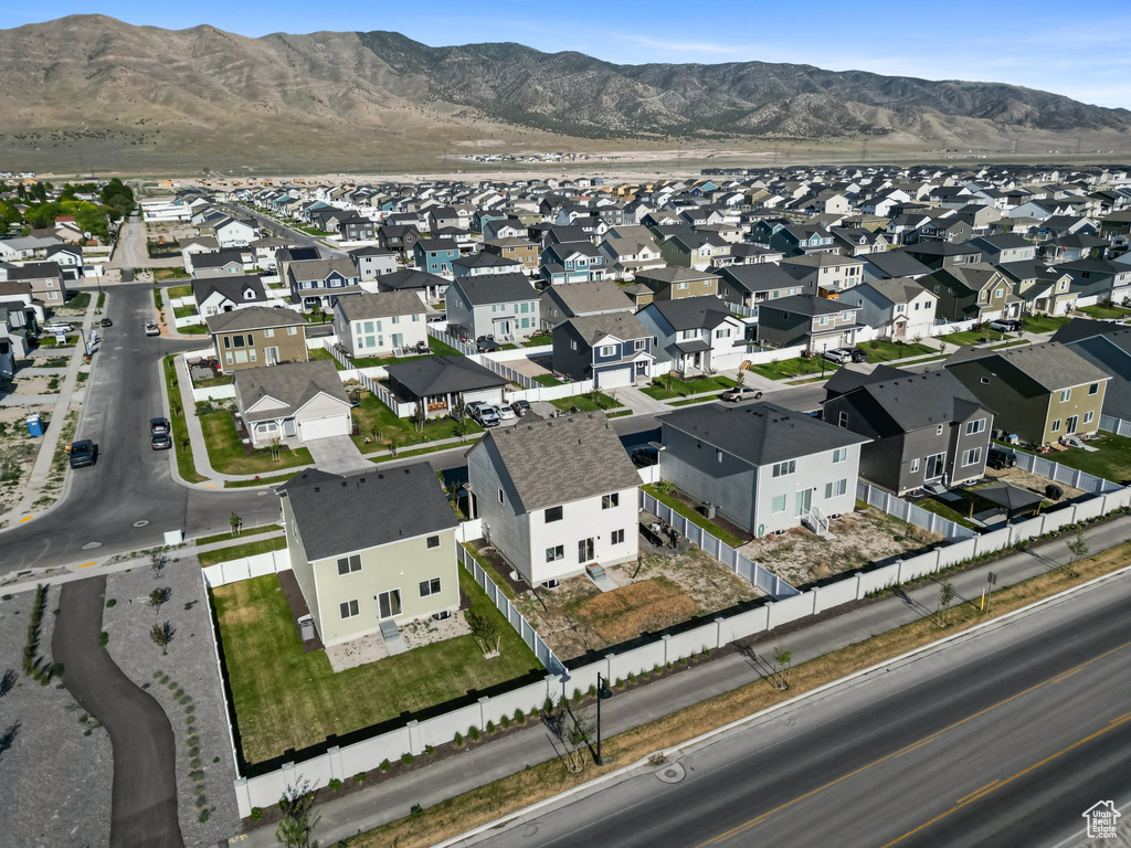 Aerial view of property\\\'s location featuring nearby suburban area and a mountainous background
