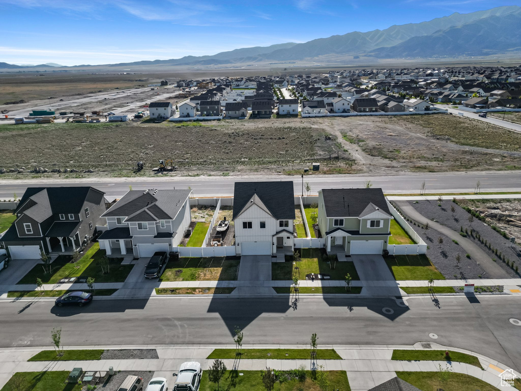 Aerial view of residential area featuring mountains