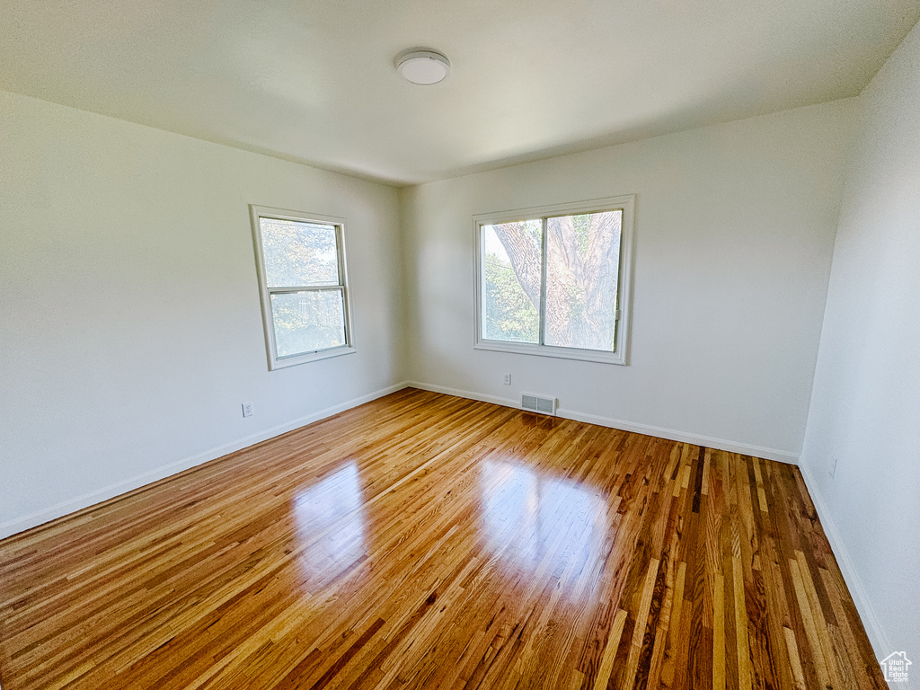 Empty room with wood finished floors and baseboards