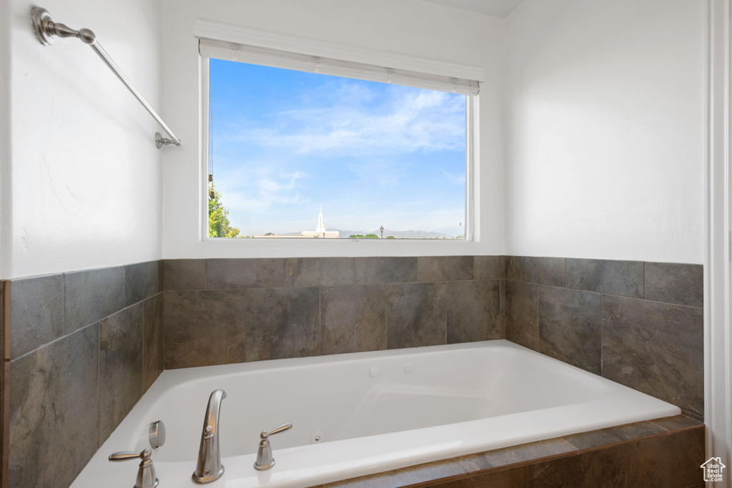 Full bathroom with a jetted tub