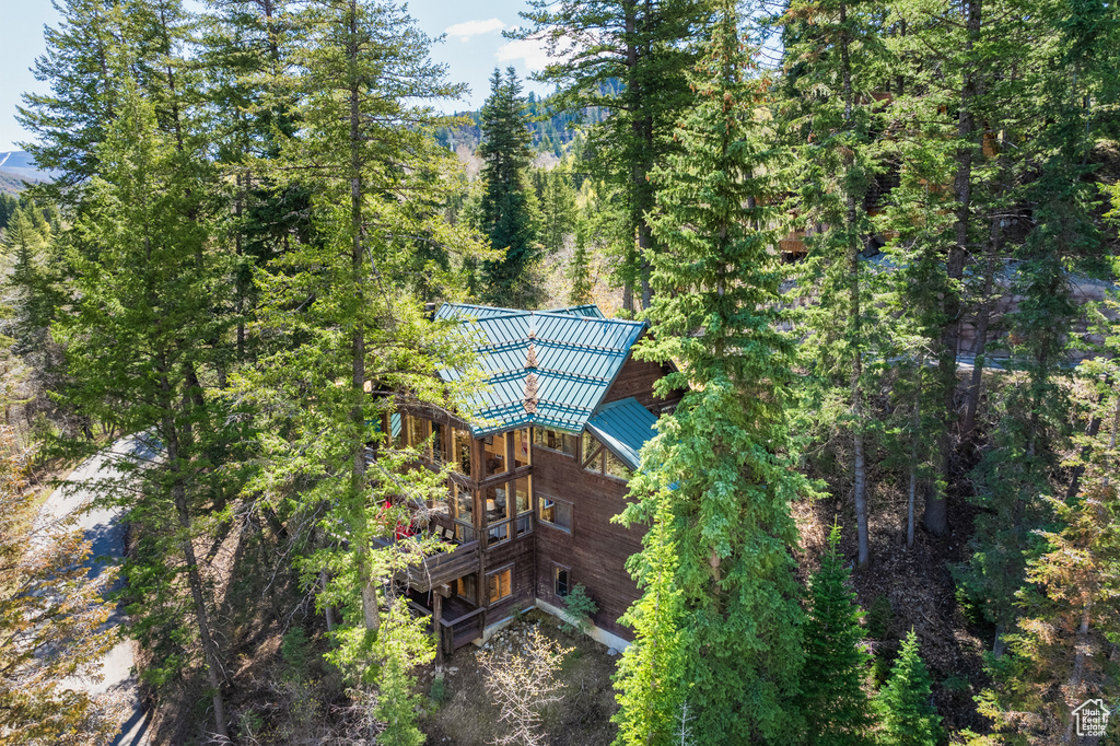 View from above of property with a heavily wooded area