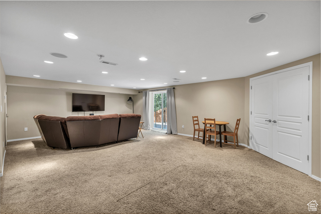 Living room featuring recessed lighting, carpet flooring, and baseboards