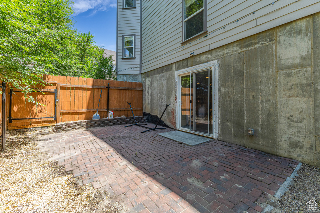 View of patio with a gate