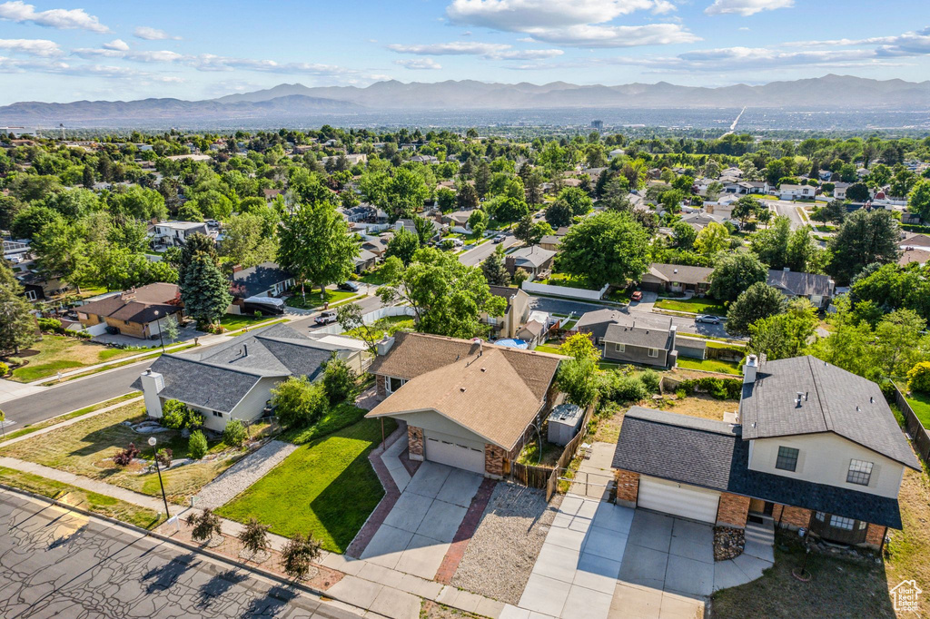 Aerial perspective of suburban area with a mountain backdrop
