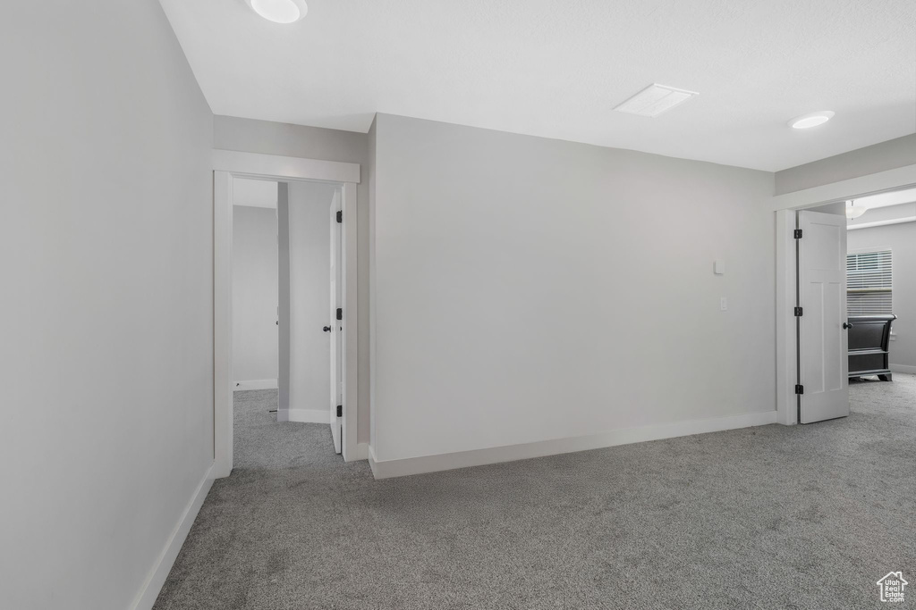 Spare room with carpet floors and baseboards