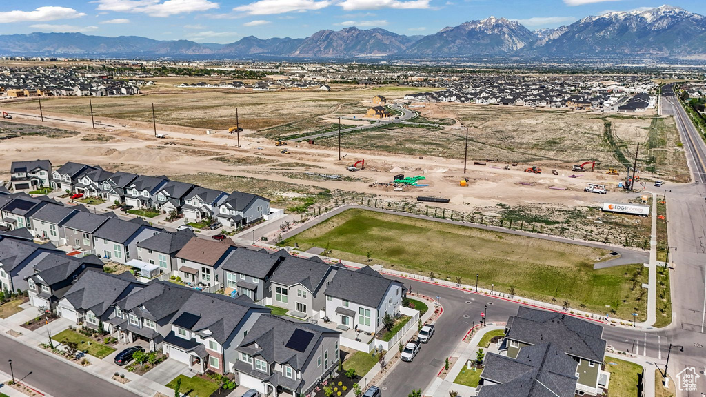 Aerial view of residential area featuring a mountain backdrop