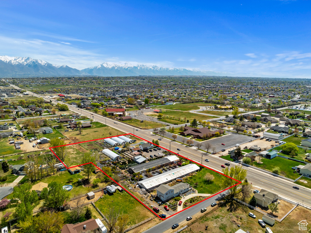 Aerial view of property's location featuring property boundaries highlighted and a mountainous background