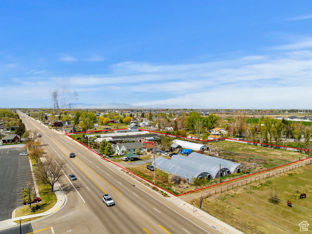 Aerial view of a mountain backdrop and a main thoroughfare