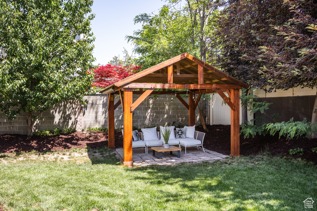 View of yard featuring a gazebo, a patio, and an outdoor living space