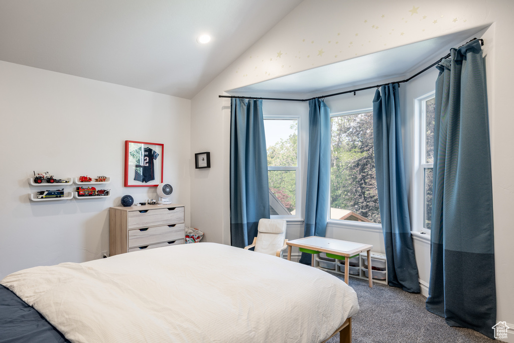 Bedroom with lofted ceiling, carpet floors, and recessed lighting
