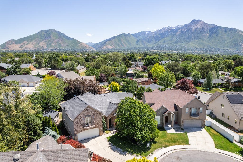 Aerial view of residential area featuring a mountain backdrop