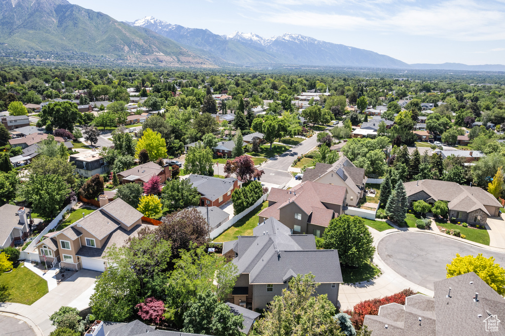Aerial view of residential area featuring a mountain backdrop