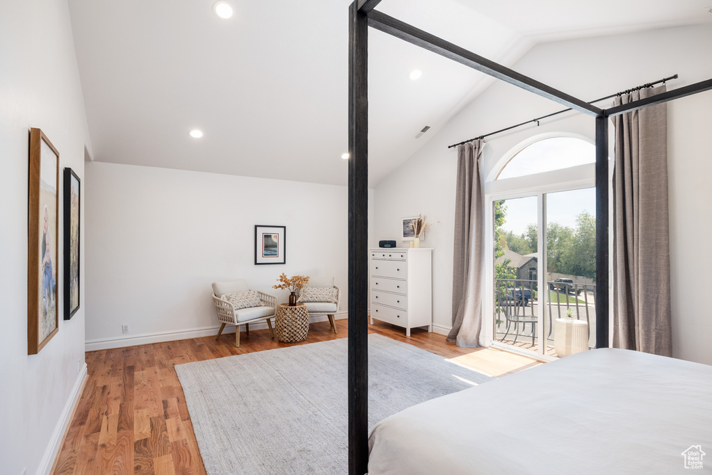 Bedroom featuring lofted ceiling, light wood finished floors, access to outside, recessed lighting, and baseboards