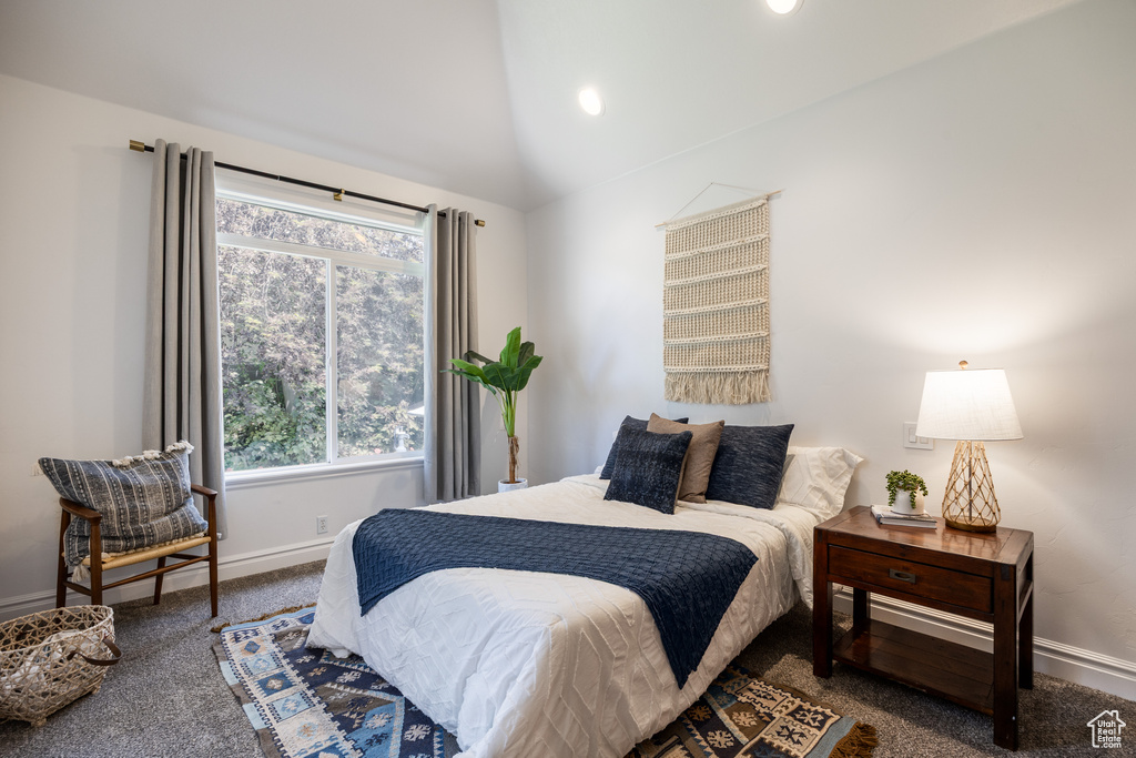 Carpeted bedroom with baseboards, lofted ceiling, and recessed lighting