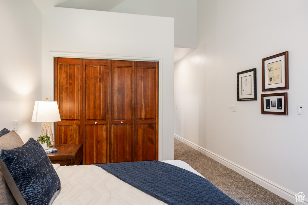 Carpeted bedroom with baseboards