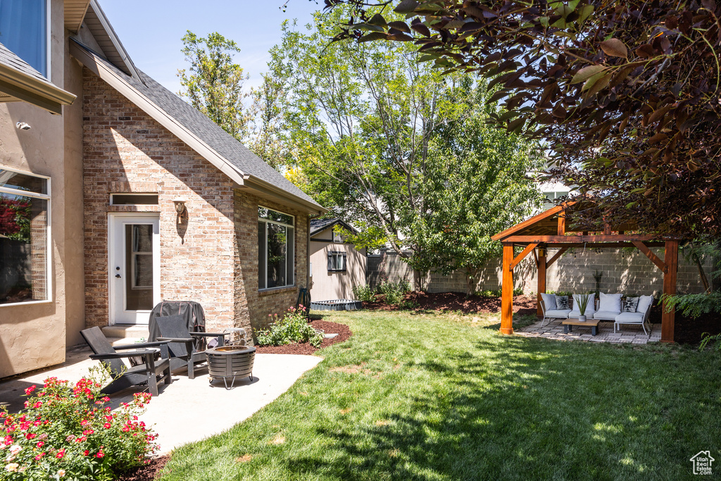 View of yard with an outdoor living space, a gazebo, and a patio