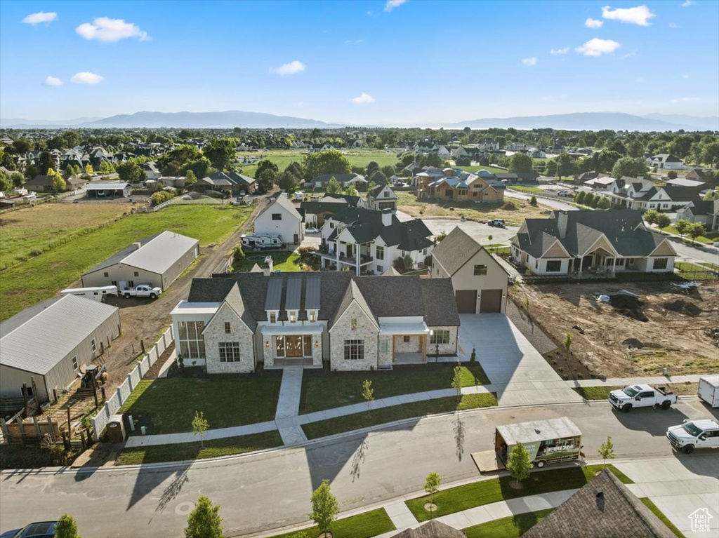 Aerial perspective of suburban area with a mountain backdrop