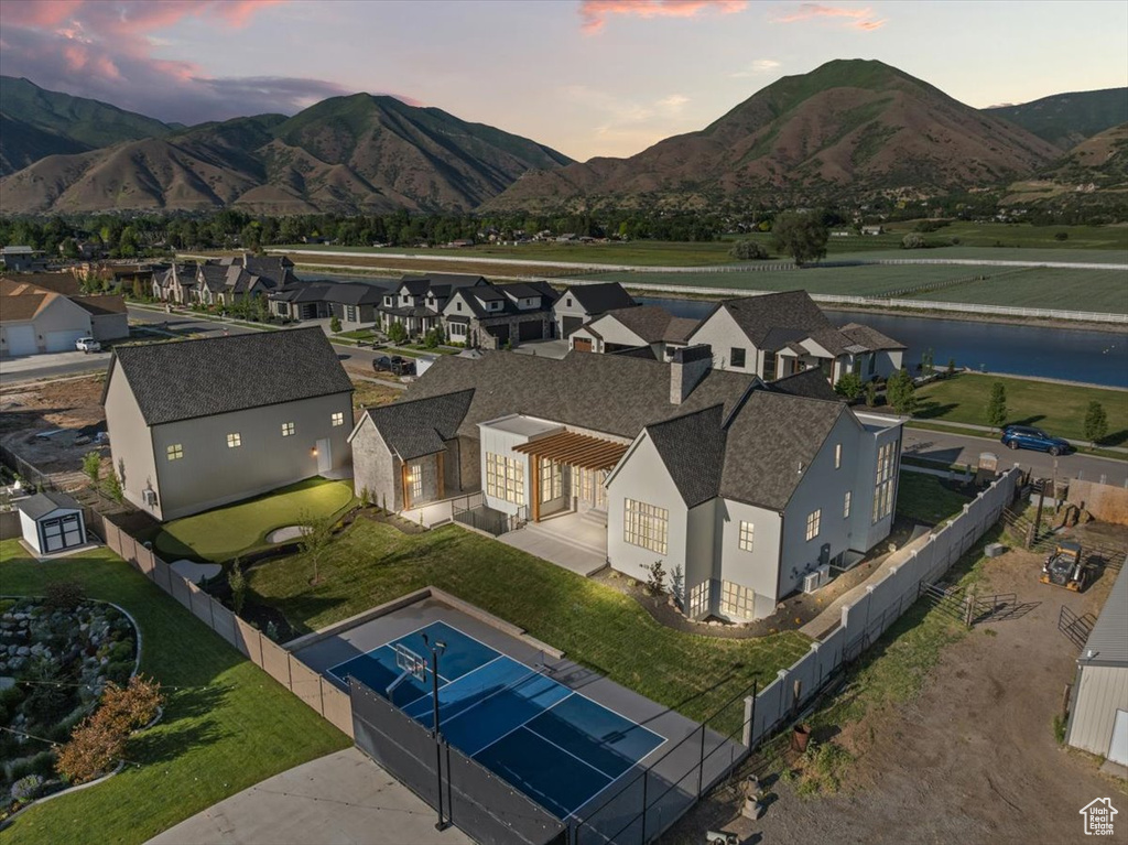View of subject property featuring a water and mountain view