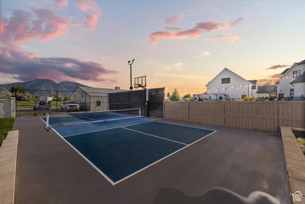 View of tennis court featuring a mountain view