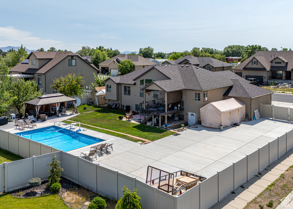 View of swimming pool featuring a gazebo, a residential view, and a patio