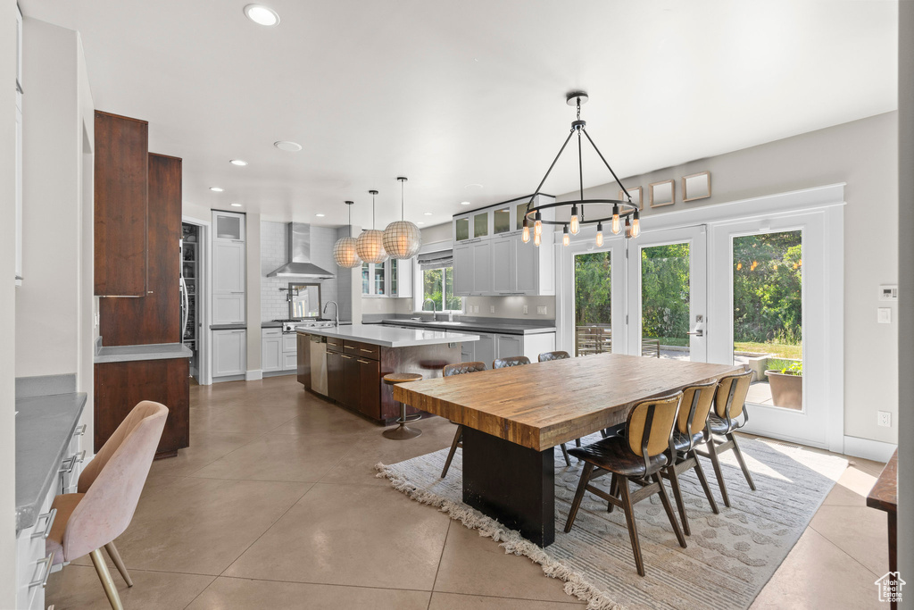 Dining area with a chandelier and recessed lighting