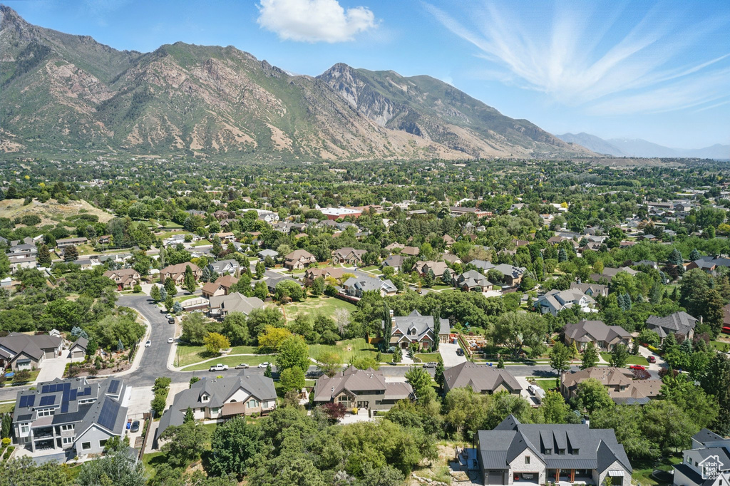 View of property location featuring a mountain backdrop and nearby suburban area