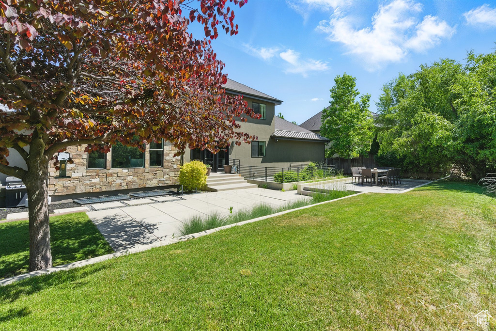 View of yard with a patio