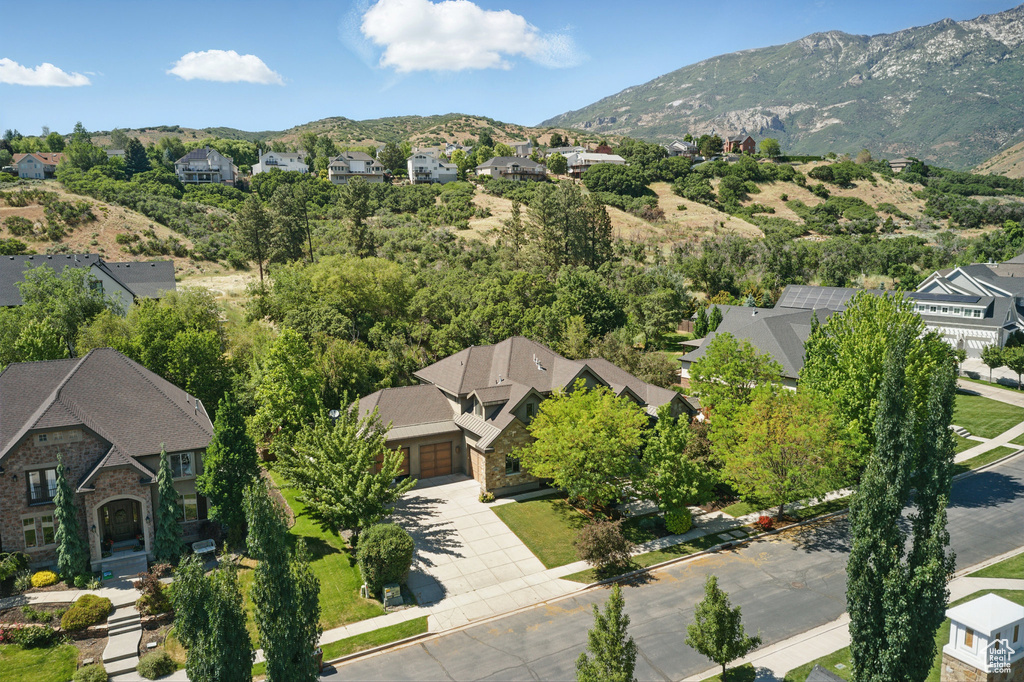 Aerial perspective of suburban area with a mountainous background