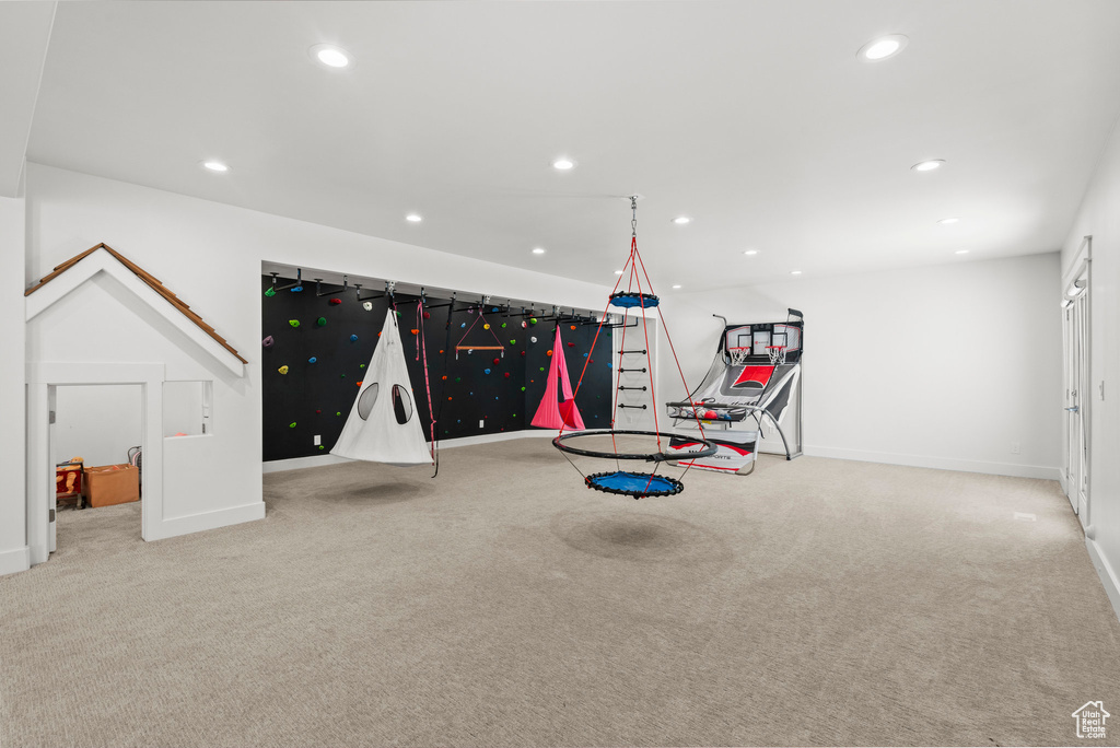 Recreation room with carpet, baseboards, and recessed lighting