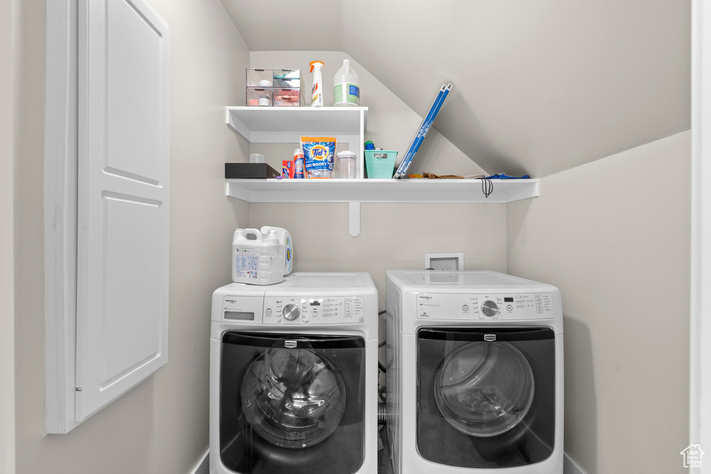 Laundry room featuring washing machine and clothes dryer