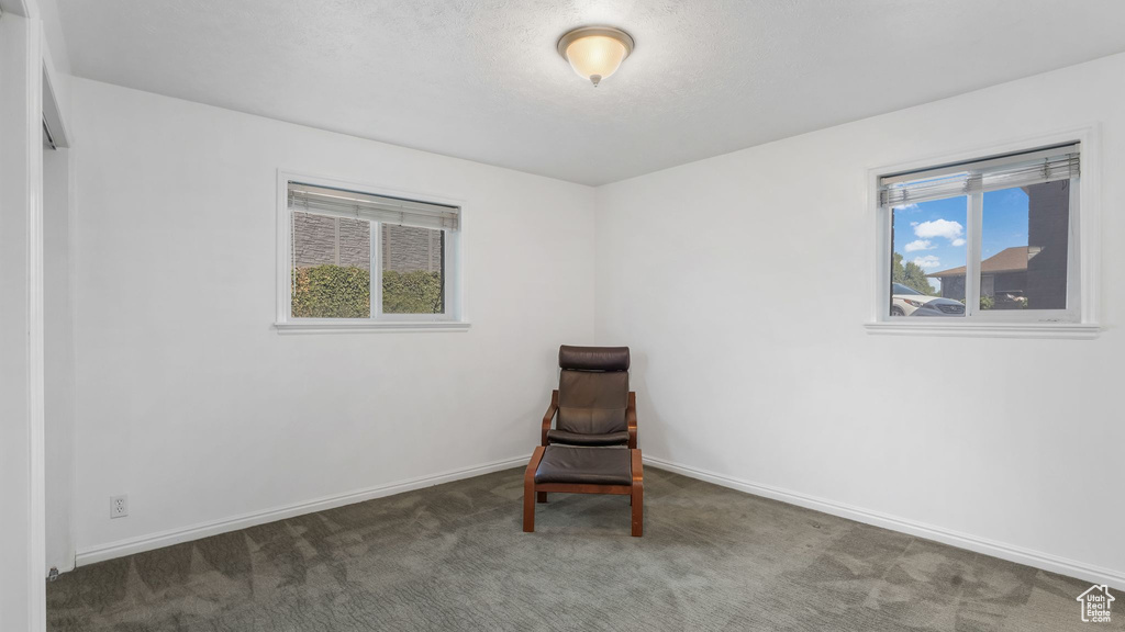 Unfurnished room featuring carpet floors and baseboards