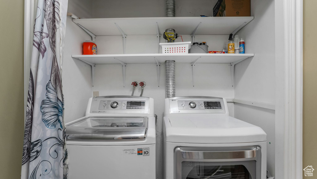 Washroom featuring washing machine and clothes dryer