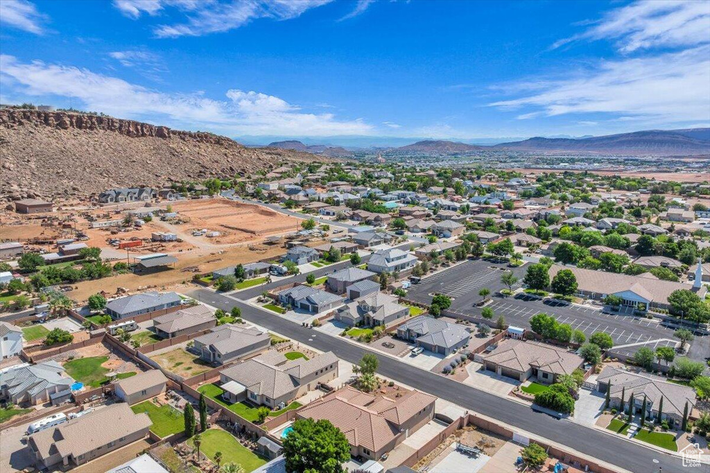 Aerial perspective of suburban area with a mountain backdrop