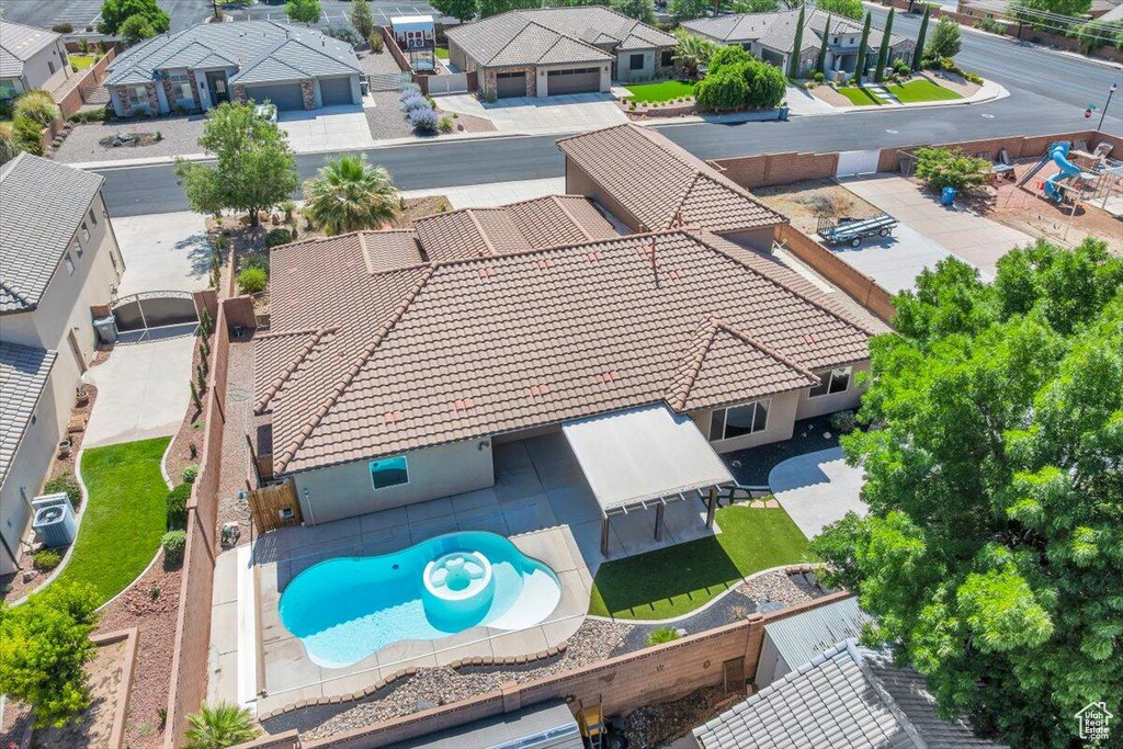 Aerial perspective of suburban area with a pool