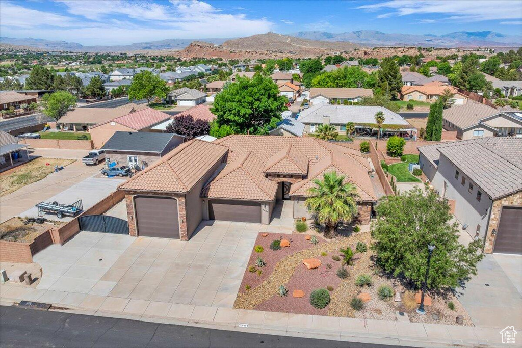 Aerial perspective of suburban area with a mountain backdrop
