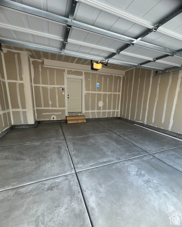 Garage featuring a garage door opener