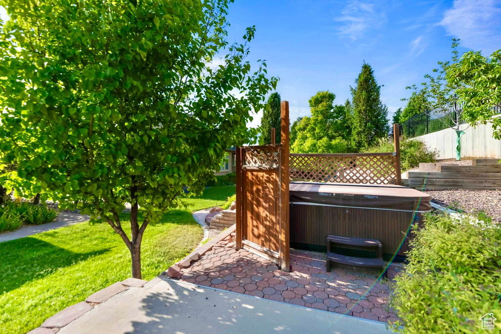 View of patio / terrace featuring a hot tub