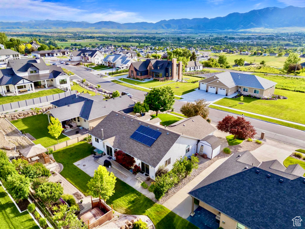 Aerial perspective of suburban area with a mountain backdrop