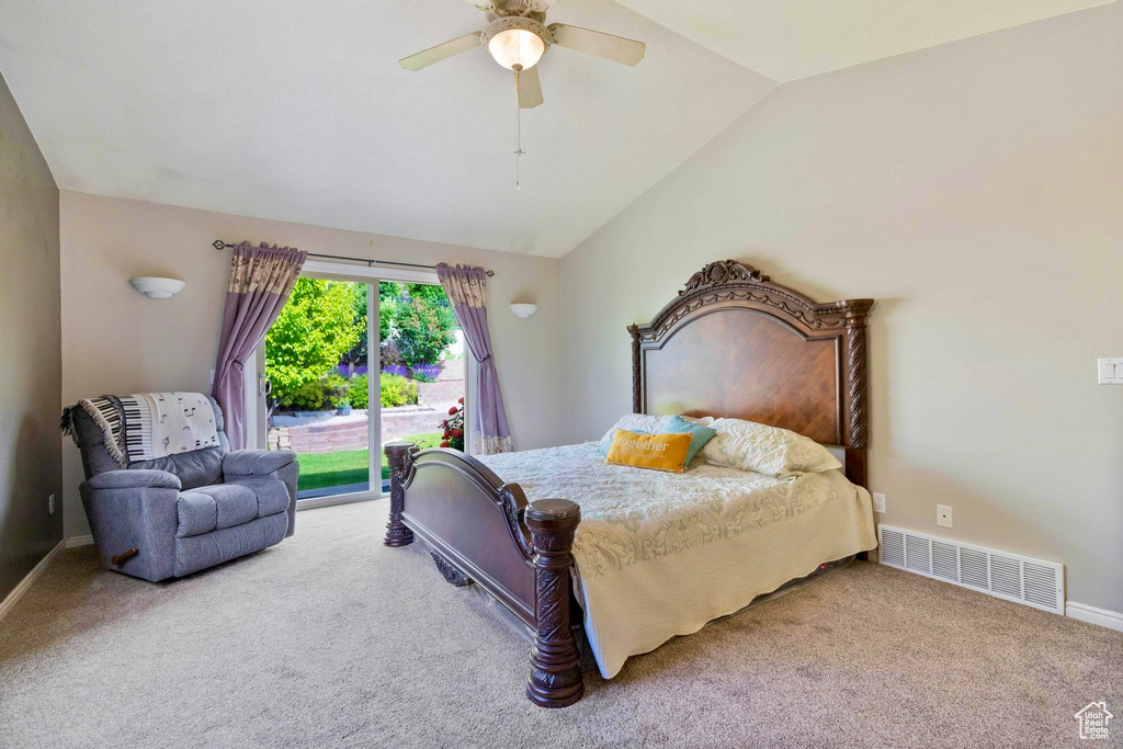 Bedroom featuring vaulted ceiling, carpet floors, access to exterior, and ceiling fan