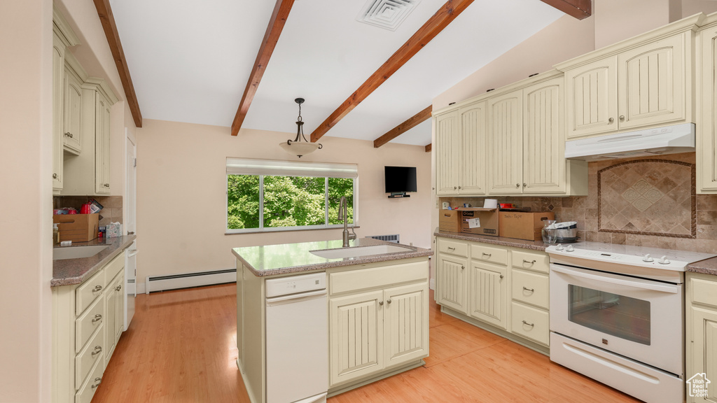 Kitchen with under cabinet range hood, white range with electric cooktop, cream cabinetry, a baseboard heating unit, and a sink
