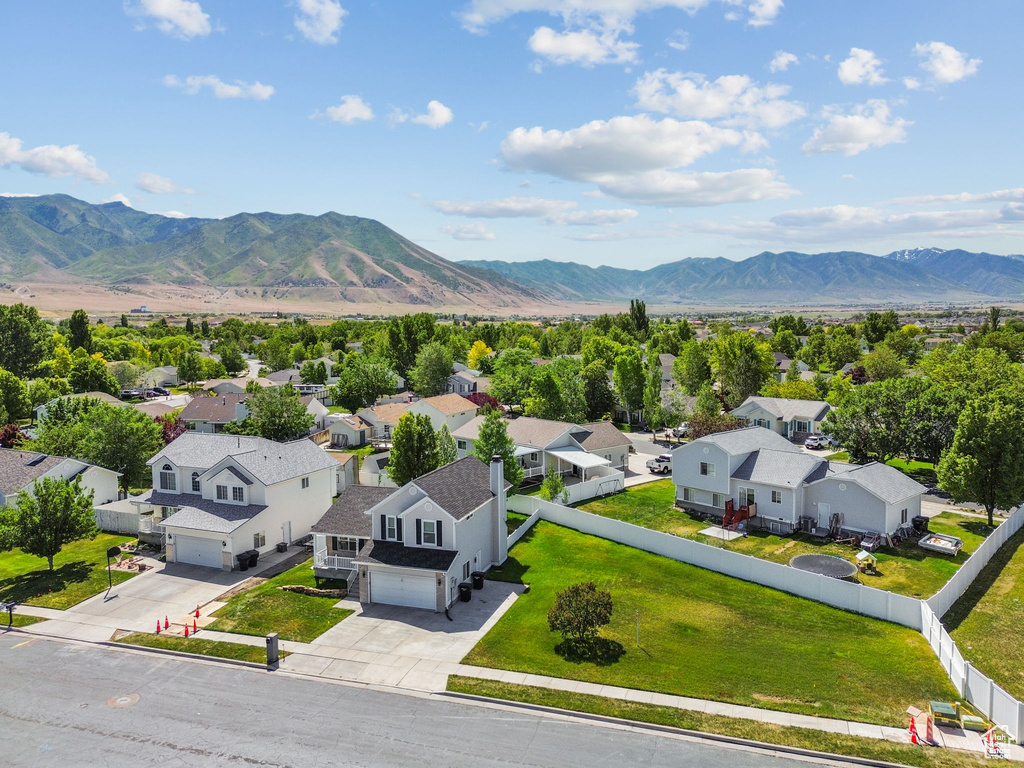 Aerial perspective of suburban area with a mountain backdrop