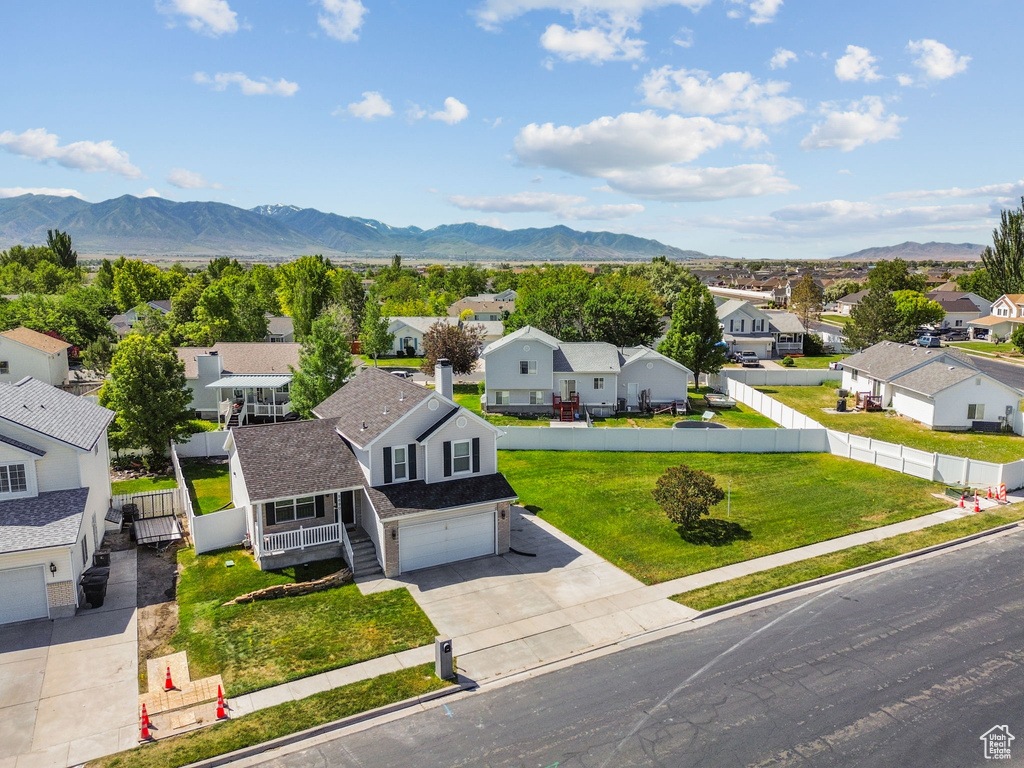 Aerial perspective of suburban area with a mountainous background