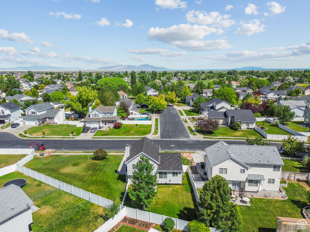 Aerial perspective of suburban area with a mountainous background